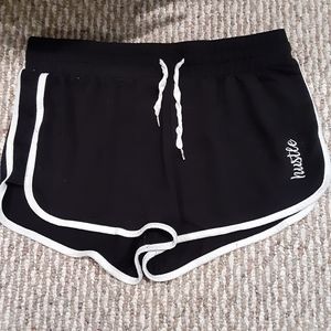 Shorts that say Hustle on the side